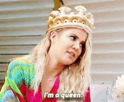 a woman wearing a crown is saying `` i 'm a queen . ''