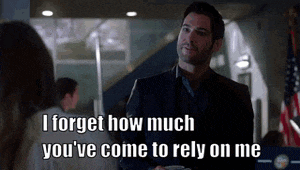 a man in a suit is talking to a woman and says i forget how much you 've come to rely