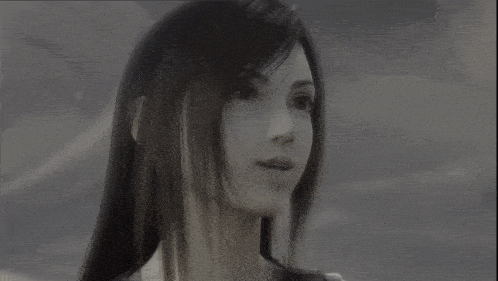 a black and white photo of a girl with long black hair