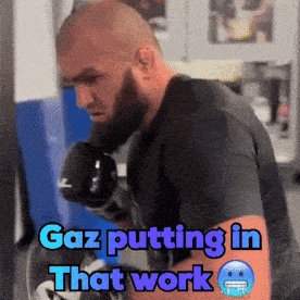 gaz putting in that work is written on a man 's arm