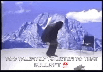 a man in a black suit is standing in front of a mountain with the words `` too talented to listen to that bullshit '' .
