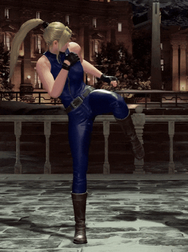 a woman in a blue jumpsuit is kicking her leg