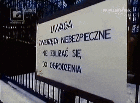 a sign that says uwaga on it in black letters