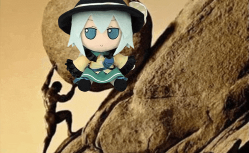 a stuffed doll is sitting on top of a rock