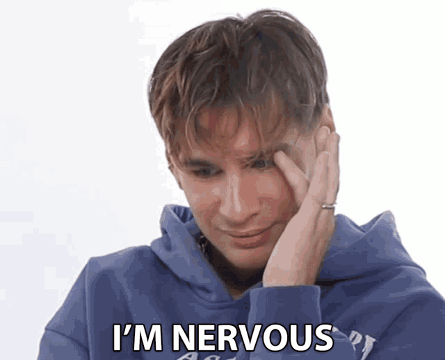a man in a blue hoodie says i 'm nervous in black letters
