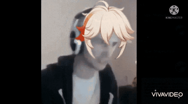 a man wearing headphones and a mask with a picture of a character on his face .