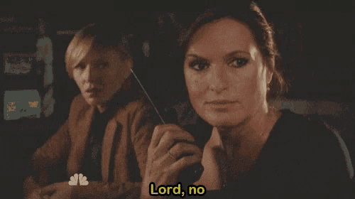 two women are sitting next to each other and one is saying lord no