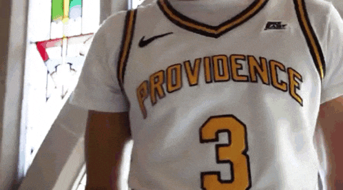 a man wearing a providence jersey with the number 3