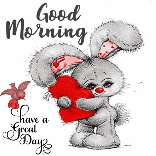 a stuffed bunny holding a red heart with the words good morning have a great day below it