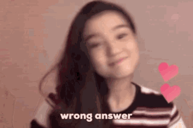 a girl with long hair is standing in front of two hearts and the words wrong answer .