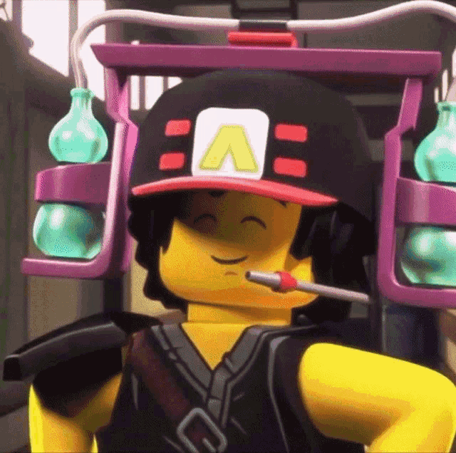 a lego man wearing a hat with the letter a on it is smiling