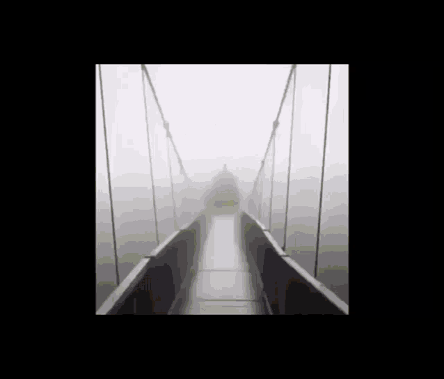 a pear with a smile on its face is walking across a bridge