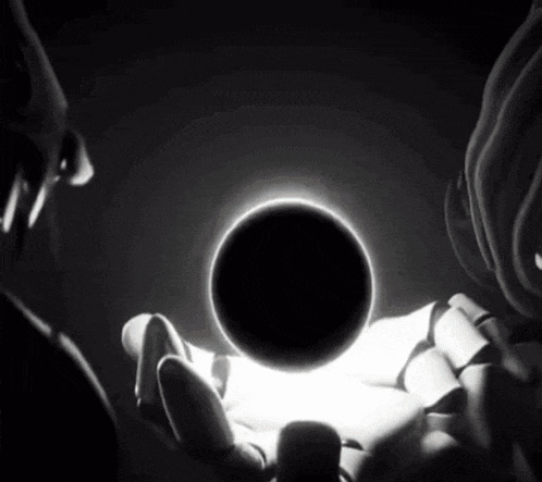 a black and white photo of a person holding a ball in their hand