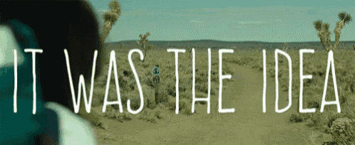 a person walking in the desert with the words it was the idea written in white