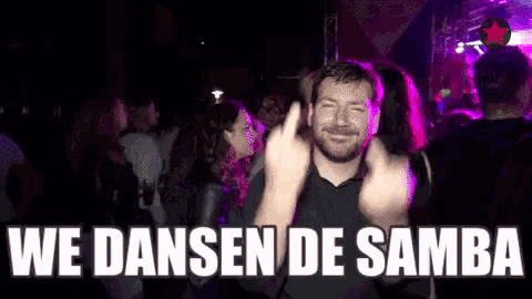 a man is giving the middle finger in a crowd with the words we dansen de samba written below him