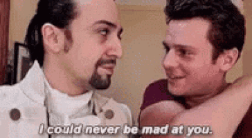 two men are standing next to each other and one of them is saying `` i could never be mad at you '' .
