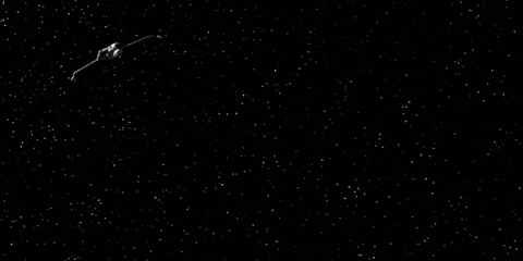 a space ship is flying through a dark space with stars in the background