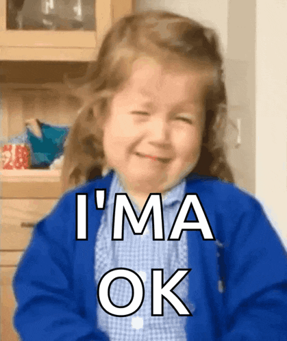a little girl in a blue jacket is crying and saying i 'm ok