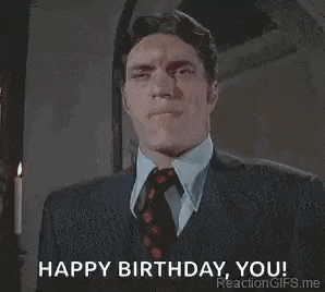 a man in a suit and tie is saying happy birthday you .