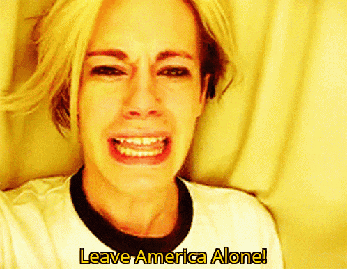a woman is crying with the words " leave america alone " behind her