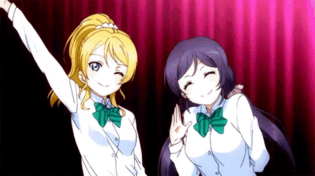 two anime girls are standing next to each other with their arms in the air