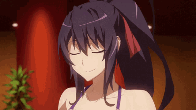 a girl with dark hair and a ponytail is smiling