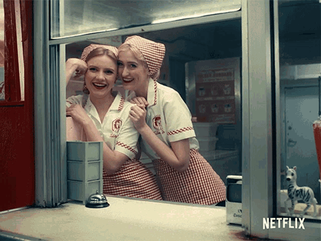 two women behind a counter with a netflix logo in the corner
