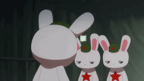 three white rabbits wearing green hats with red stars are standing next to each other