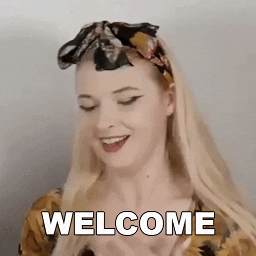 a woman wearing a headband and a scarf is making a welcome gesture .