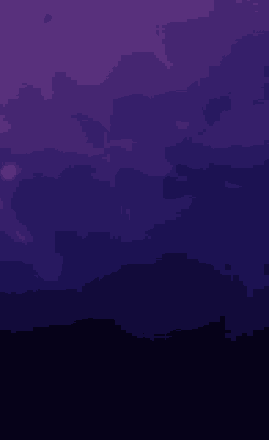 a purple background with a few clouds and a light shining through them .