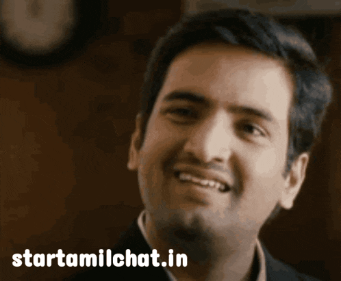 a man is smiling in front of a starttamilchat.in logo