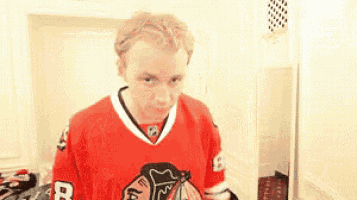 a man is wearing a red jersey with the number 8 on it