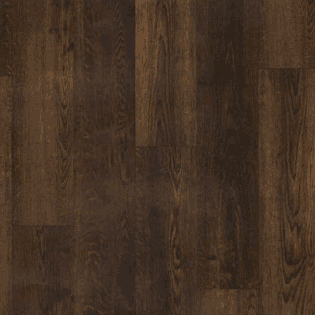a close up of a wooden floor with a grain and a texture .