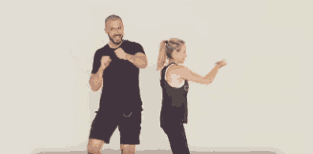 a man and a woman are standing next to each other