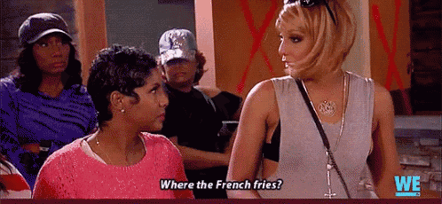 two women are standing next to each other and one is asking where the french fries