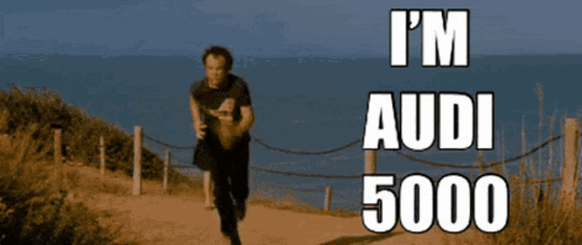 a man running down a path with the words i 'm audi 5000 written on the bottom