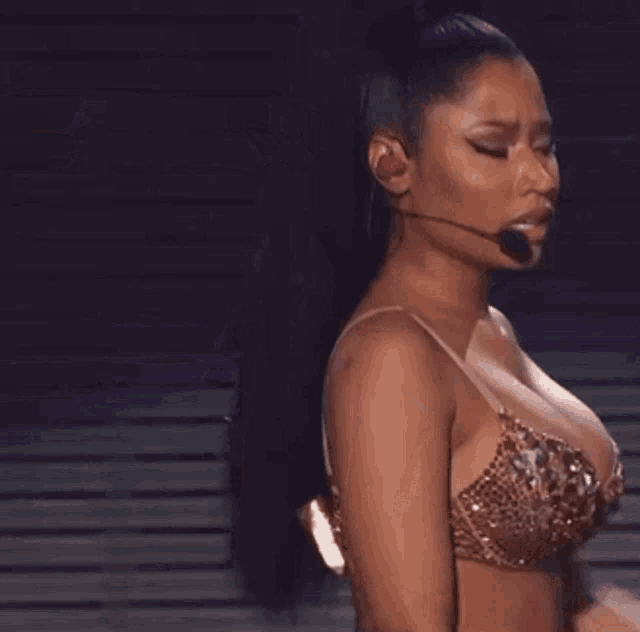 a woman in a bra is surrounded by a bunch of question marks