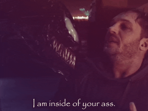 a man with a beard is standing next to a monster with the words " i am inside of your ass " on the bottom