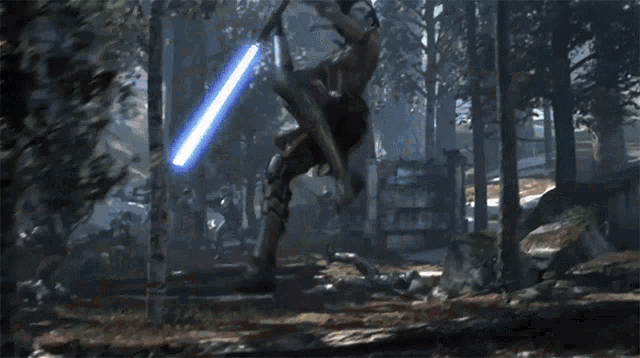 a man with a red light saber is fighting another man with a blue light saber