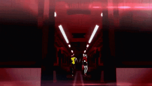 a man in a yellow shirt and a woman in a red shirt are dancing on a train