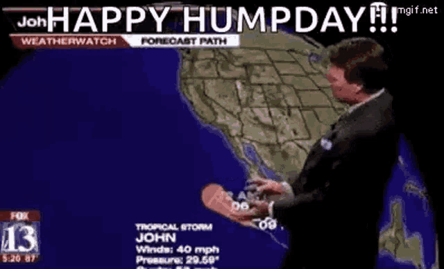 a weatherman is standing in front of a map of the united states holding a hot dog .