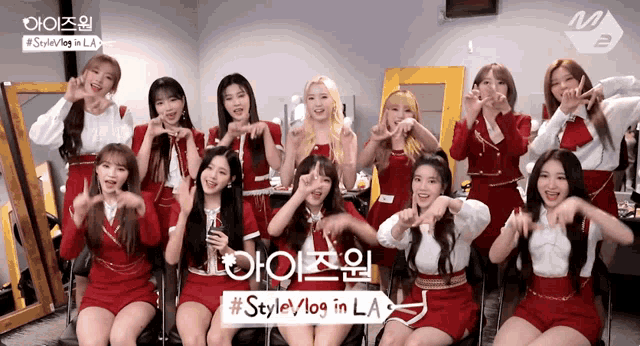 a group of girls are posing for a picture with a sign that says style vlog in la