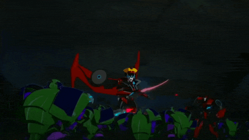 a group of transformers are standing in the dark