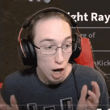 a young man wearing headphones and glasses is talking on a video call .