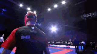 a man in a boxing ring with the word jako on the wall behind him