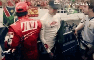 a man in a red jacket with the word twd on the back