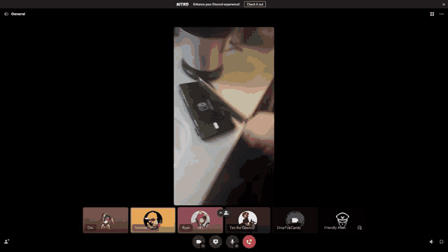a screenshot of a video call with a phone on the counter