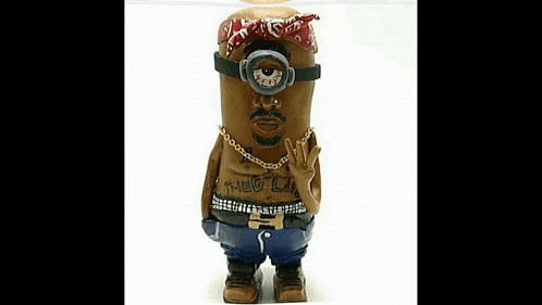 a statue of a minion dressed as tupac shakur is giving a peace sign