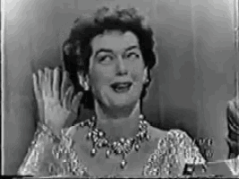 a black and white photo of a woman waving her hand