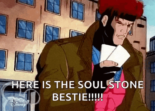 a cartoon character is holding a pair of cards and says `` here is the soul stone bestie !!! ''